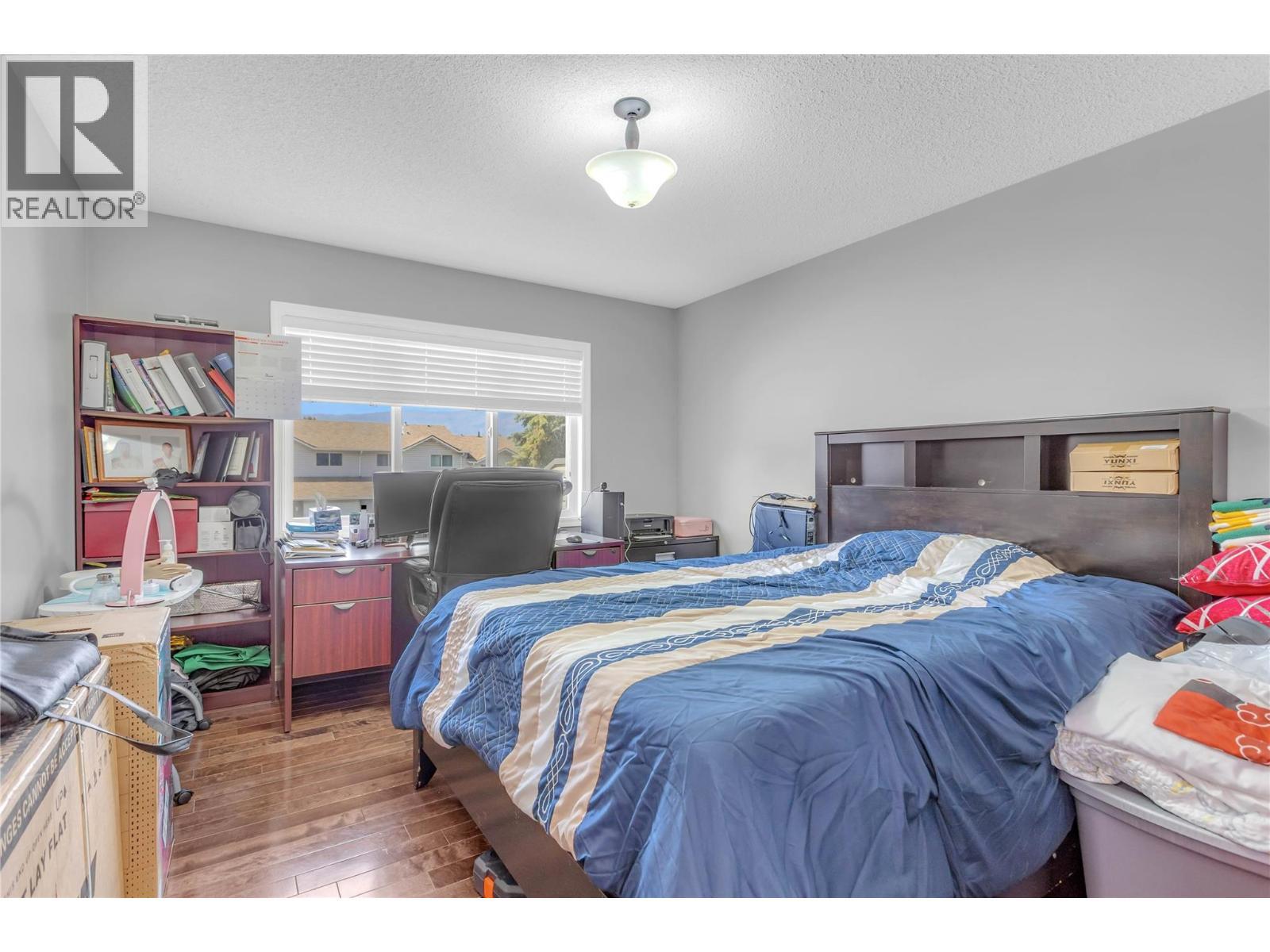 1675 Thayer Court Unit# 1, Kelowna, BC - Indoor Photo Showing Bedroom