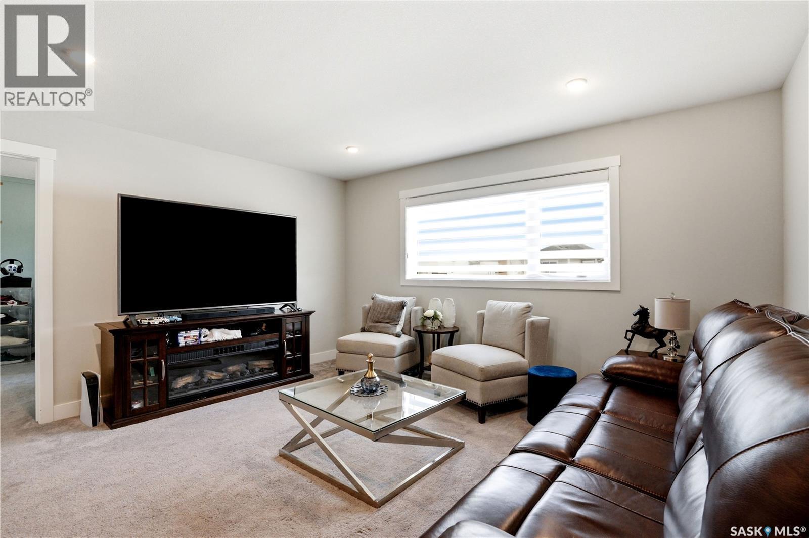 206 Kenaschuk Union, Saskatoon, SK - Indoor Photo Showing Living Room