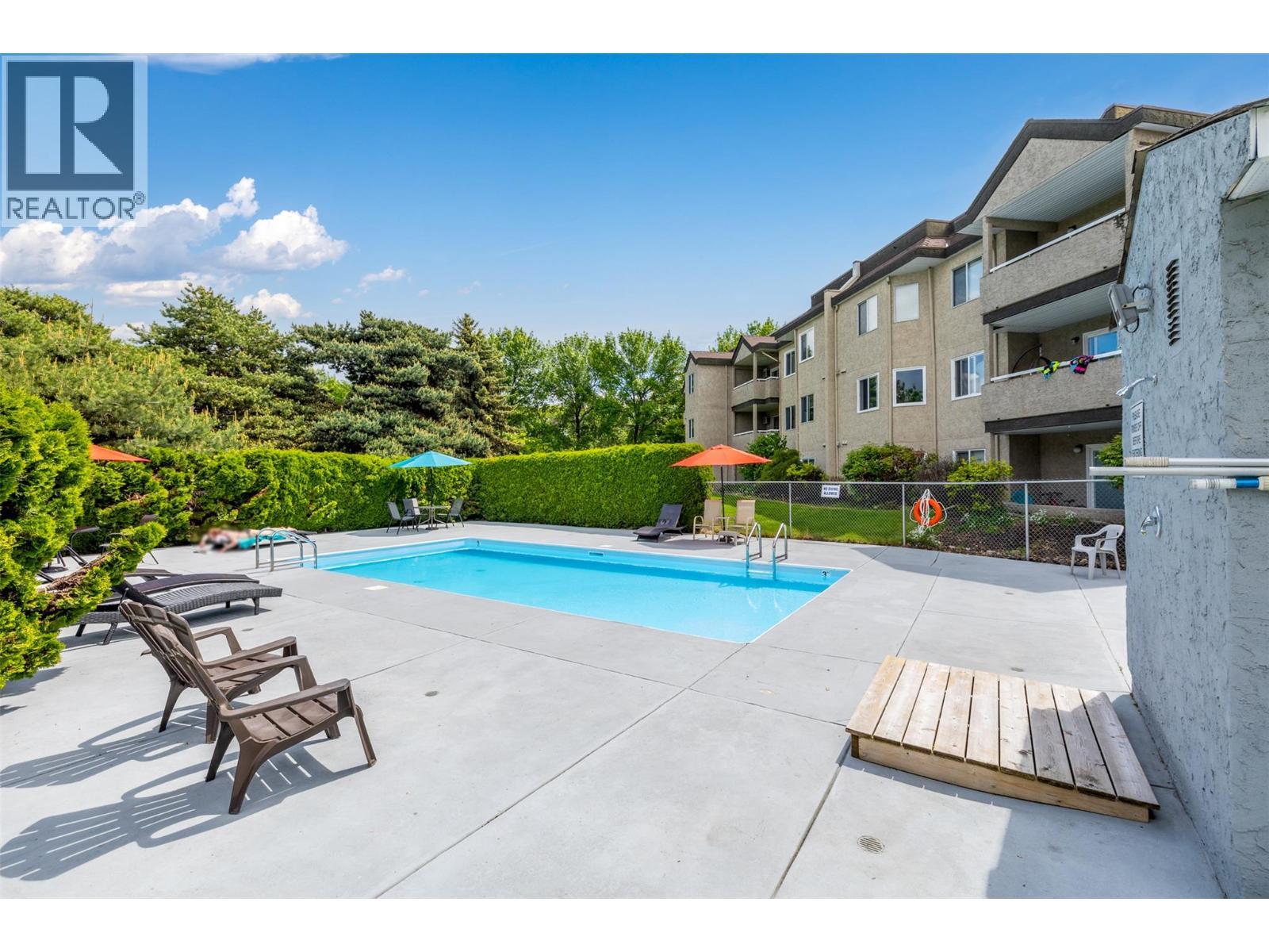 735 Cook Road Unit# 104C, Kelowna, BC - Outdoor With In Ground Pool