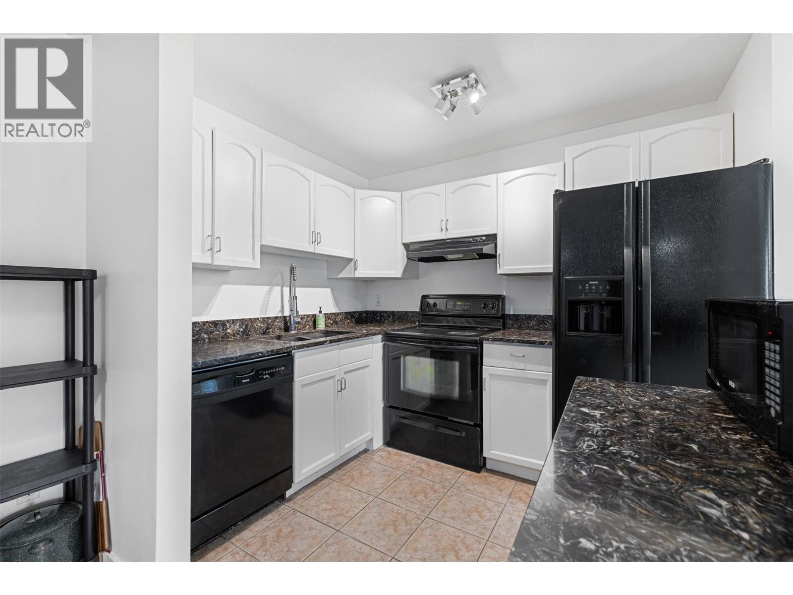 735 Cook Road Unit# 104C, Kelowna, BC - Indoor Photo Showing Kitchen With Double Sink