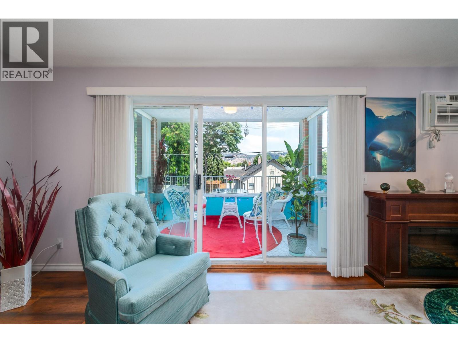 878 Bernard Avenue Unit# 103, Kelowna, BC - Indoor Photo Showing Other Room With Fireplace