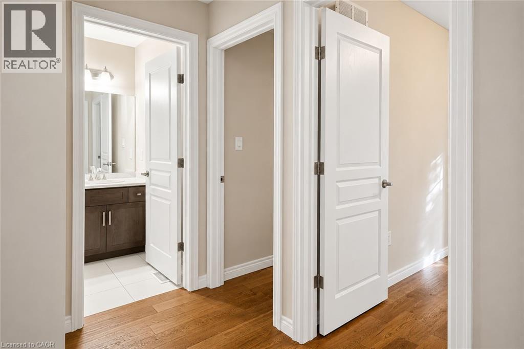 Hallway featuring wood-finish flooring and neutral wall tones - 133 St Leger Street, Kitchener, ON - Indoor Photo Showing Other Room