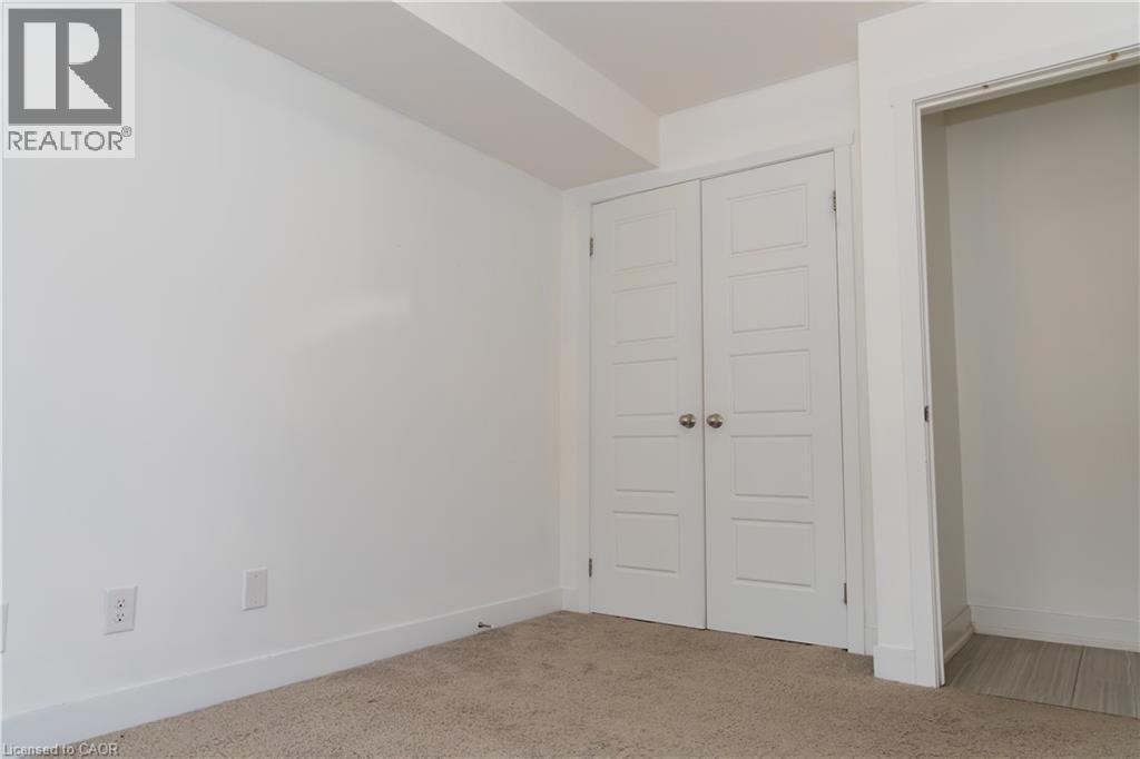 Room featuring white walls and neutral carpet flooring - 190 Century Hill Drive Unit# A5, Kitchener, ON - Indoor Photo Showing Other Room