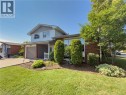 Brick and siding exterior with mature landscaping - 143 Cromwell Crescent, Hamilton, ON  - Outdoor 
