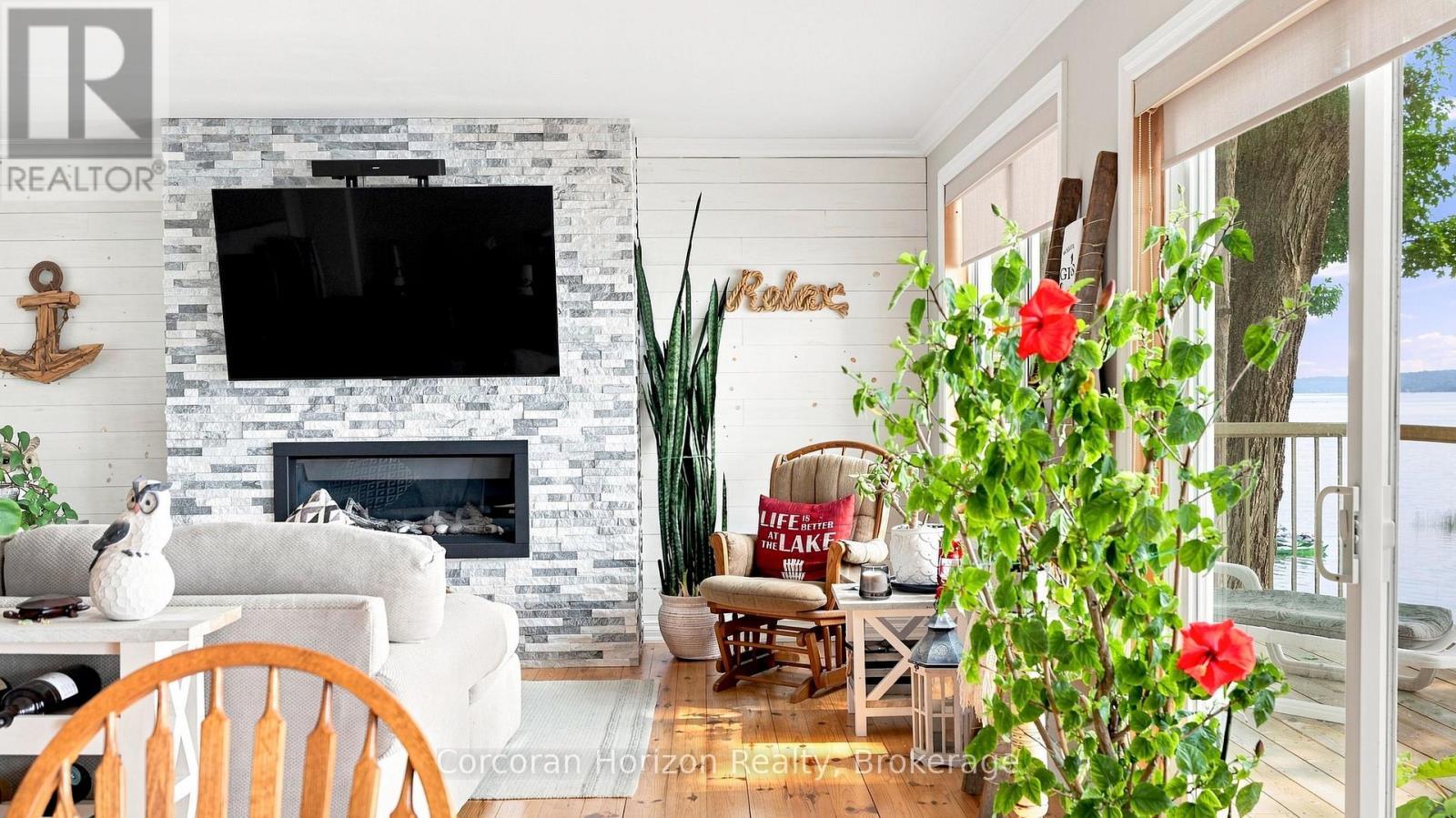 380 Robins Point Road, Tay (Victoria Harbour), ON - Indoor With Fireplace