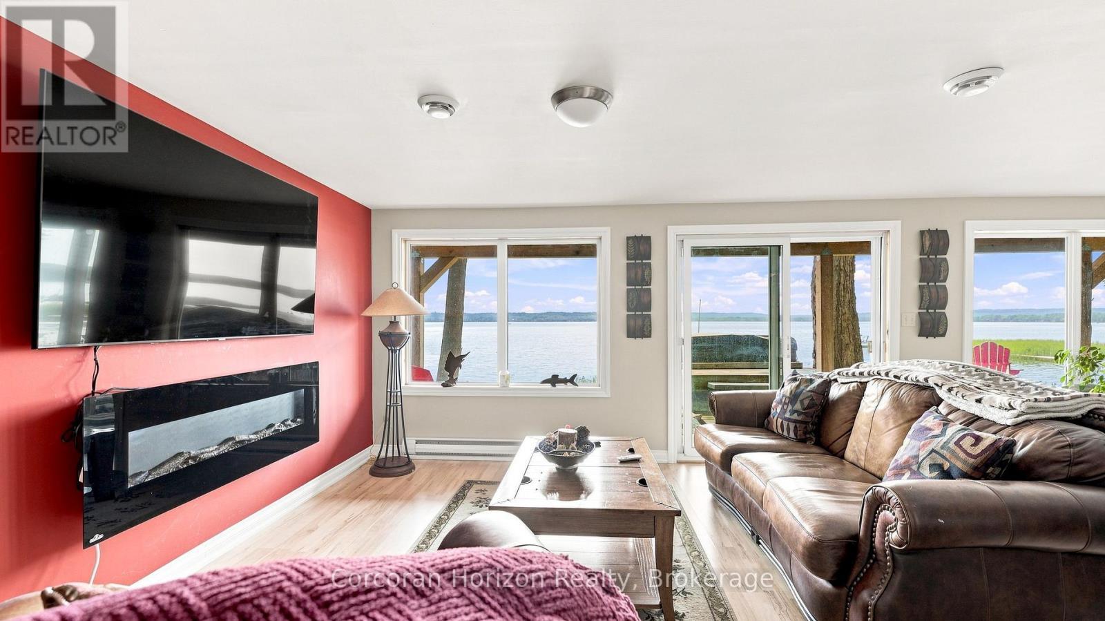 380 Robins Point Road, Tay (Victoria Harbour), ON - Indoor Photo Showing Living Room With Fireplace