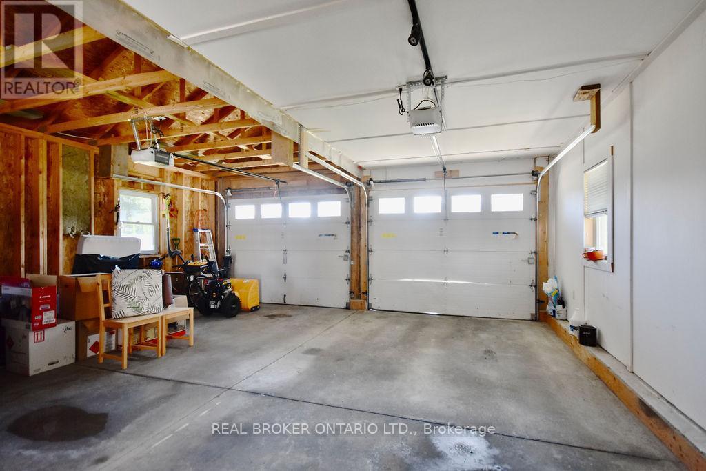 Double car garage - 5818 Victoria Park Road, Ramara, ON - Indoor Photo Showing Garage