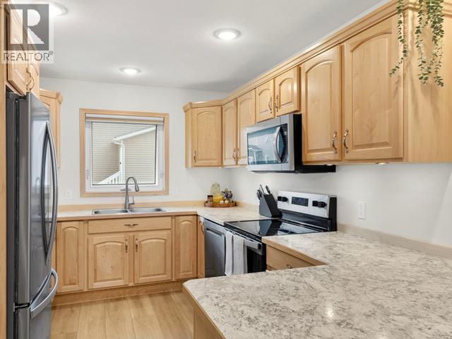 105-250 Olive May Way, Whitehorse, YT - Indoor Photo Showing Kitchen With Double Sink