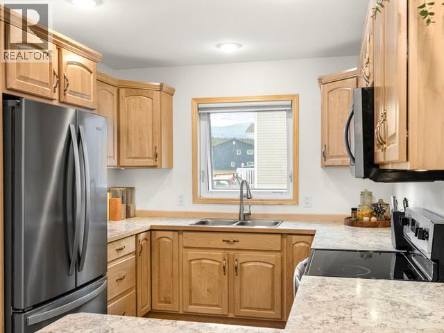 105-250 Olive May Way, Whitehorse, YT - Indoor Photo Showing Kitchen With Double Sink