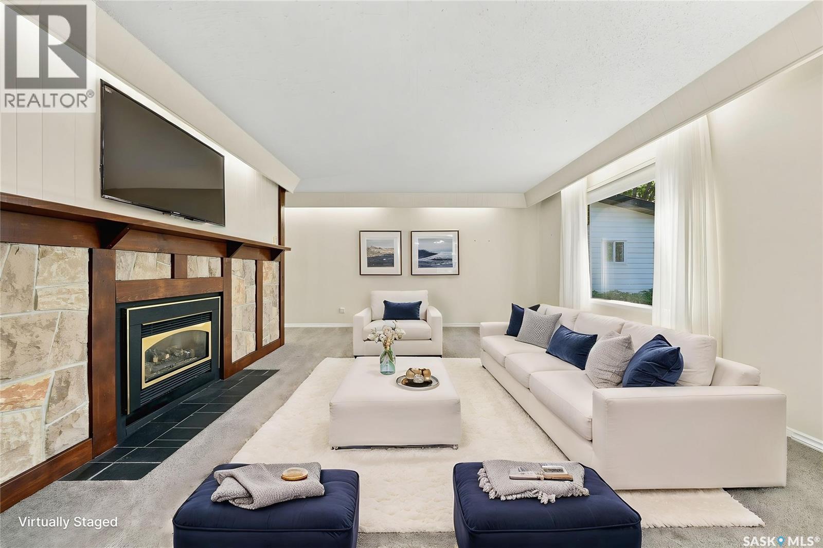 725 7Th Street E, Saskatoon, SK - Indoor Photo Showing Living Room With Fireplace