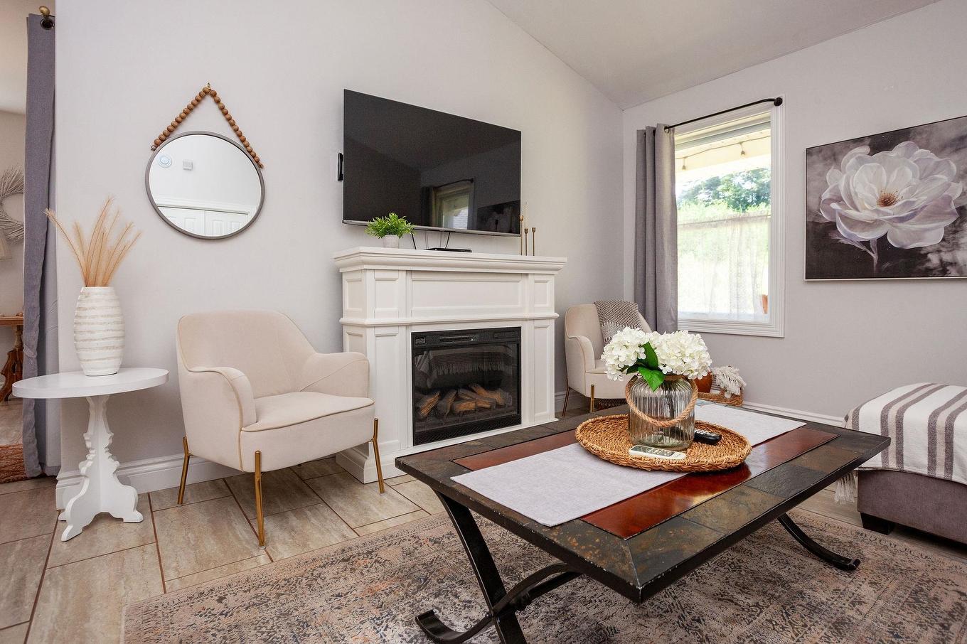 22 170 Schoolhouse Lane, Stanley Bridge, PE - Indoor Photo Showing Living Room With Fireplace