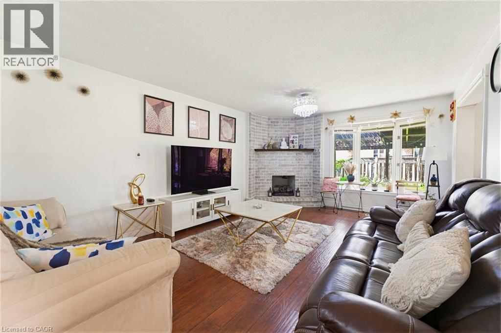 459 Dicenzo Drive, Hamilton, ON - Indoor Photo Showing Living Room With Fireplace