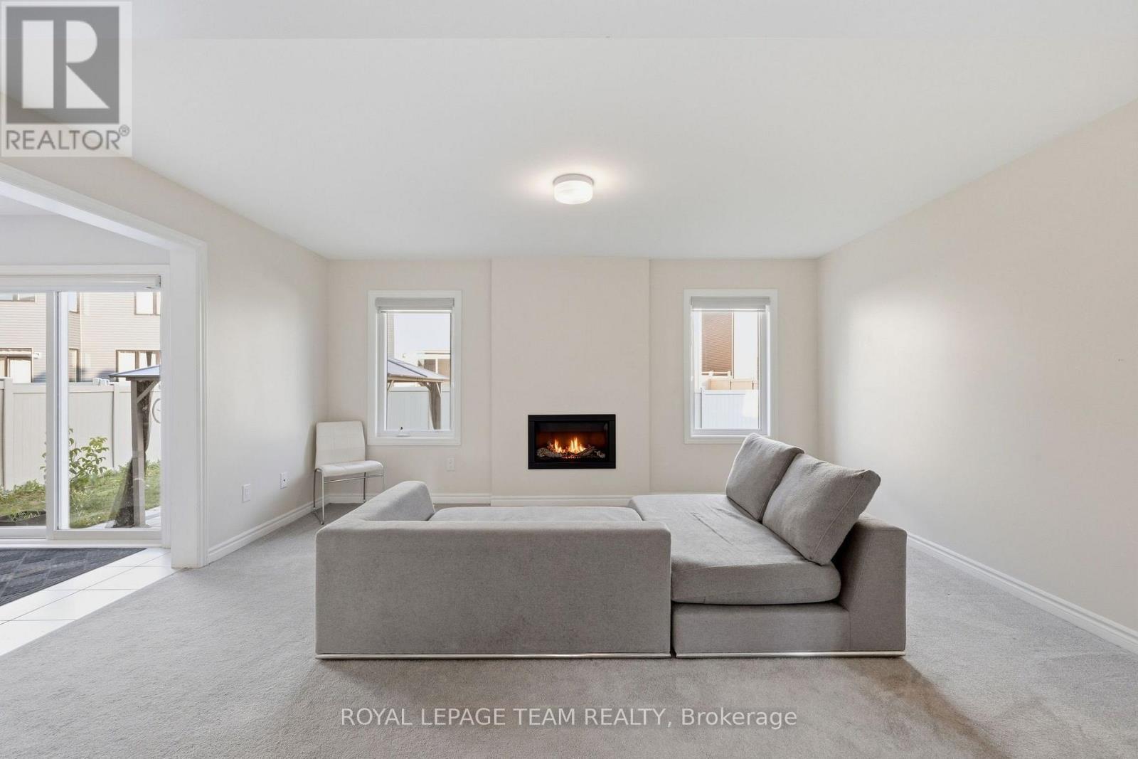 Living Room w Gas Fireplace - 153 Unity Place, Ottawa, ON - Indoor Photo Showing Living Room With Fireplace