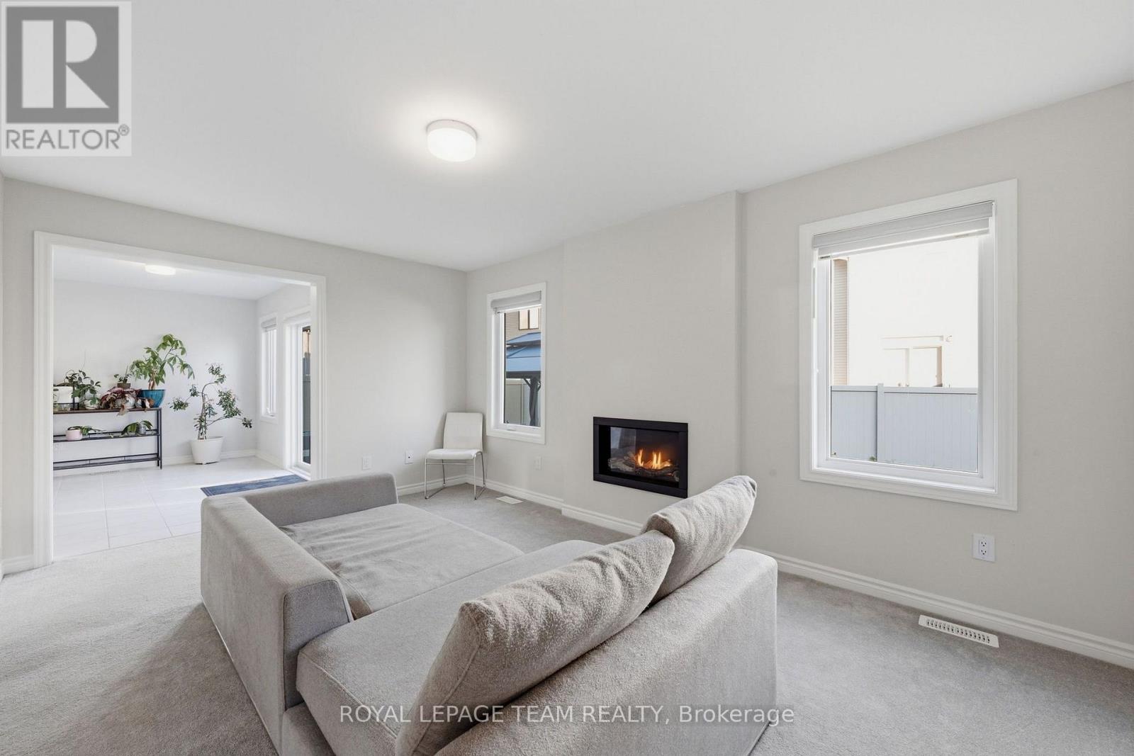 Living Room w Gas Fireplace - 153 Unity Place, Ottawa, ON - Indoor Photo Showing Living Room With Fireplace