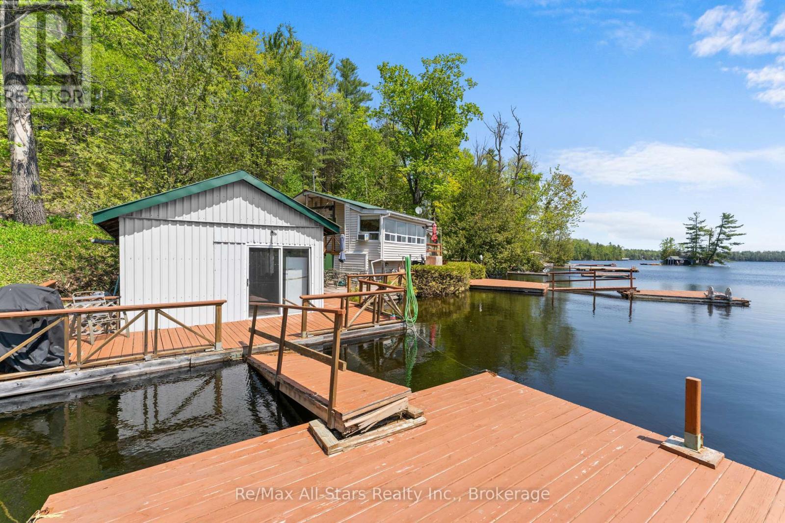55 Fire Route 393, Trent Lakes, ON - Outdoor With Body Of Water With Deck Patio Veranda