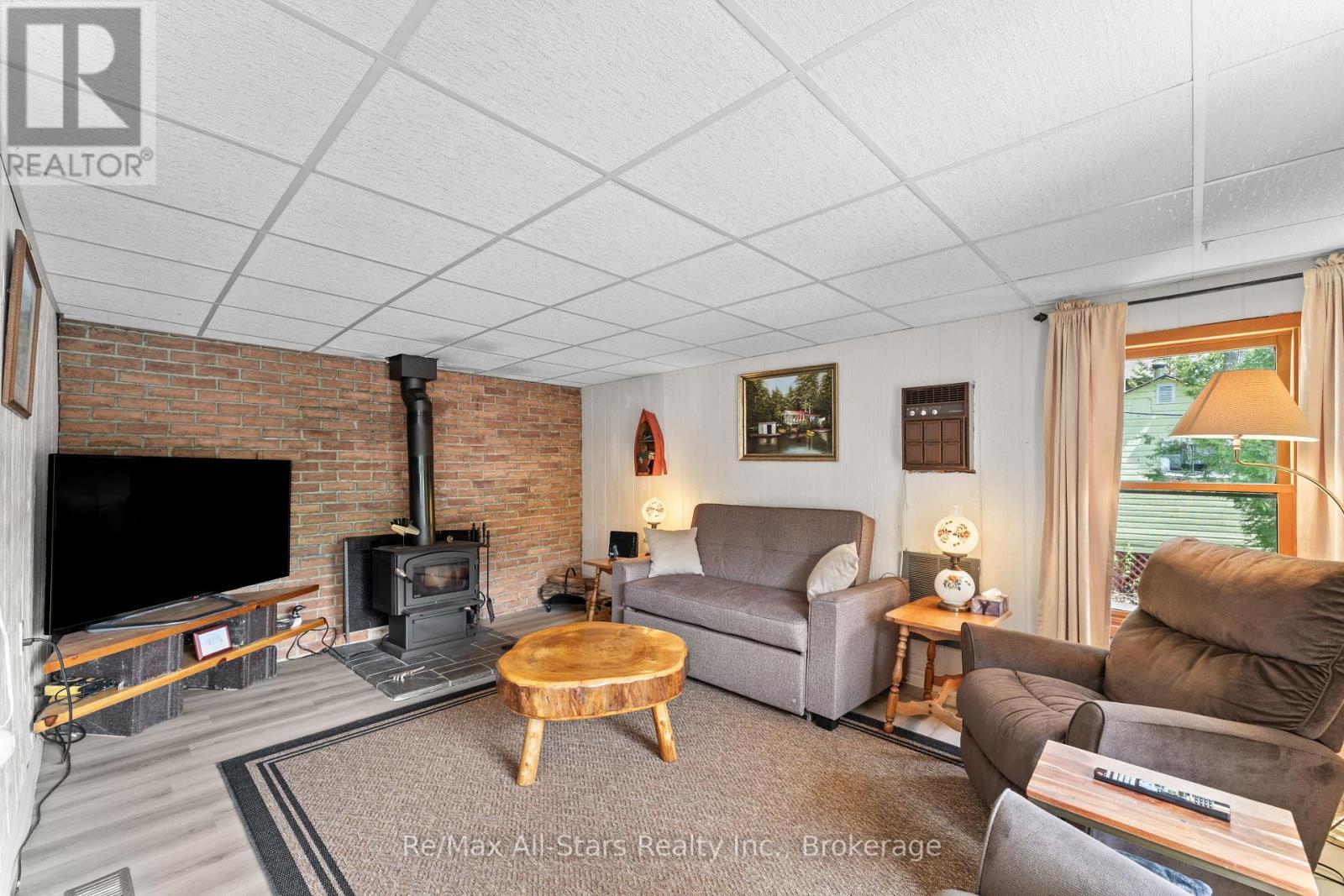 55 Fire Route 393, Trent Lakes, ON - Indoor Photo Showing Living Room With Fireplace