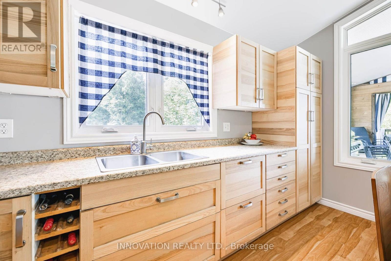688 Dewitt Lane, Frontenac (Frontenac South), ON - Indoor Photo Showing Kitchen With Double Sink