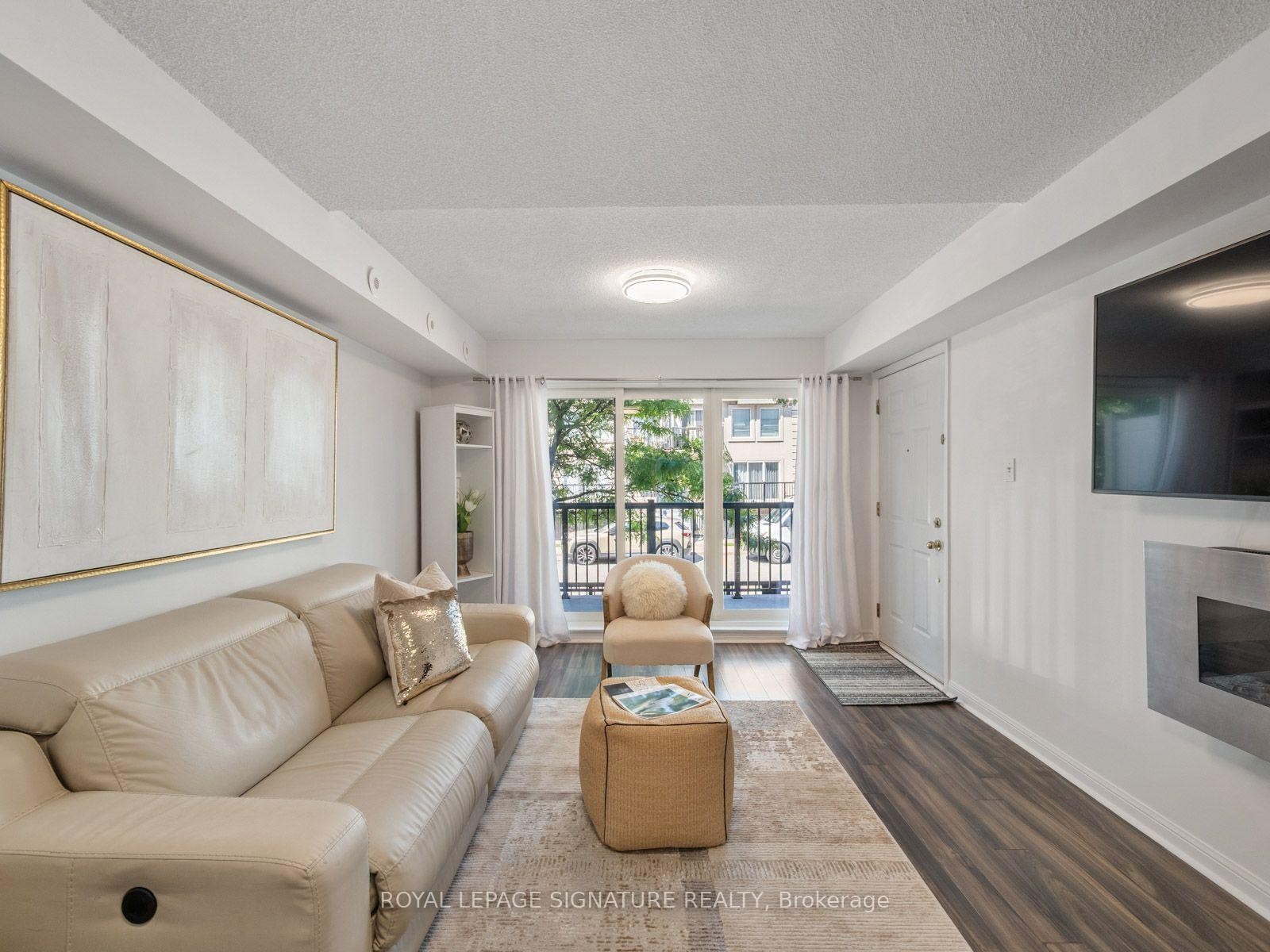 2067-65 George Appleton Way, Toronto, ON - Indoor Photo Showing Living Room With Fireplace