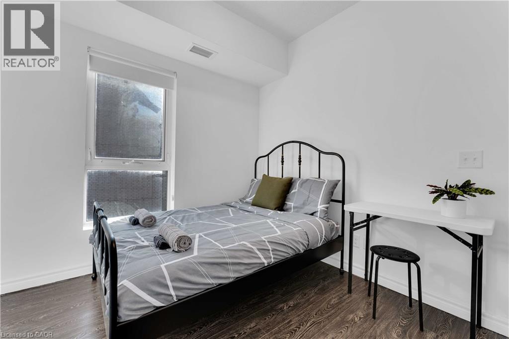Room featuring wood-finish flooring and white painted walls - 158 King Street N Unit# 81201, Waterloo, ON - Indoor Photo Showing Bedroom