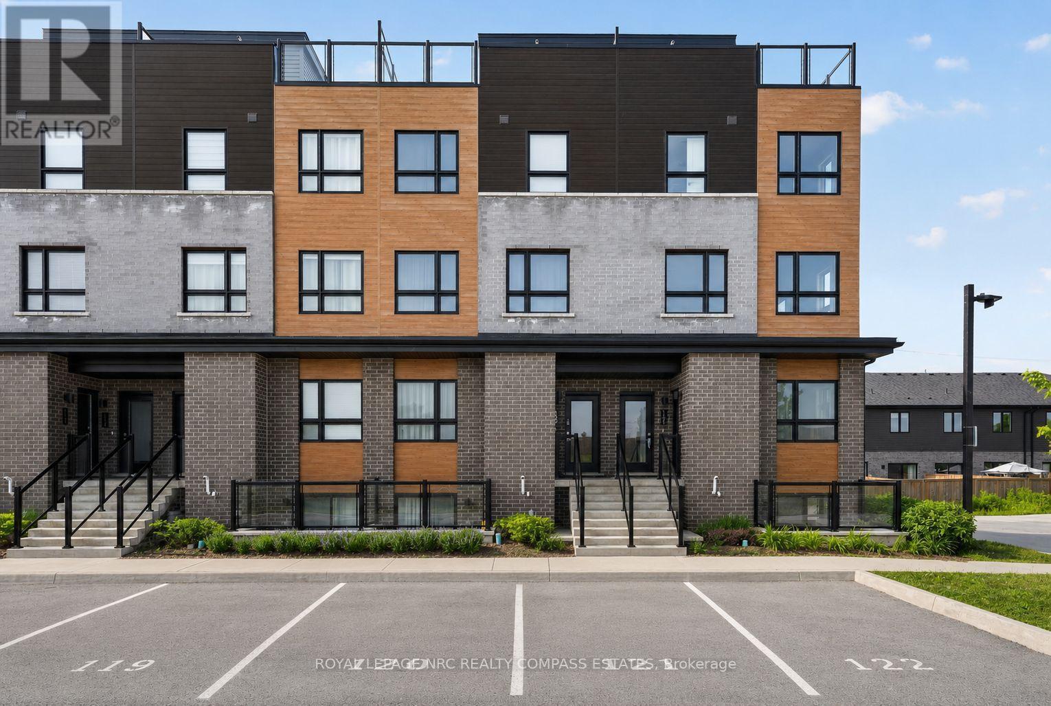 119 - 6705 Cropp Street, Niagara Falls (Morrison), ON - Outdoor With Facade