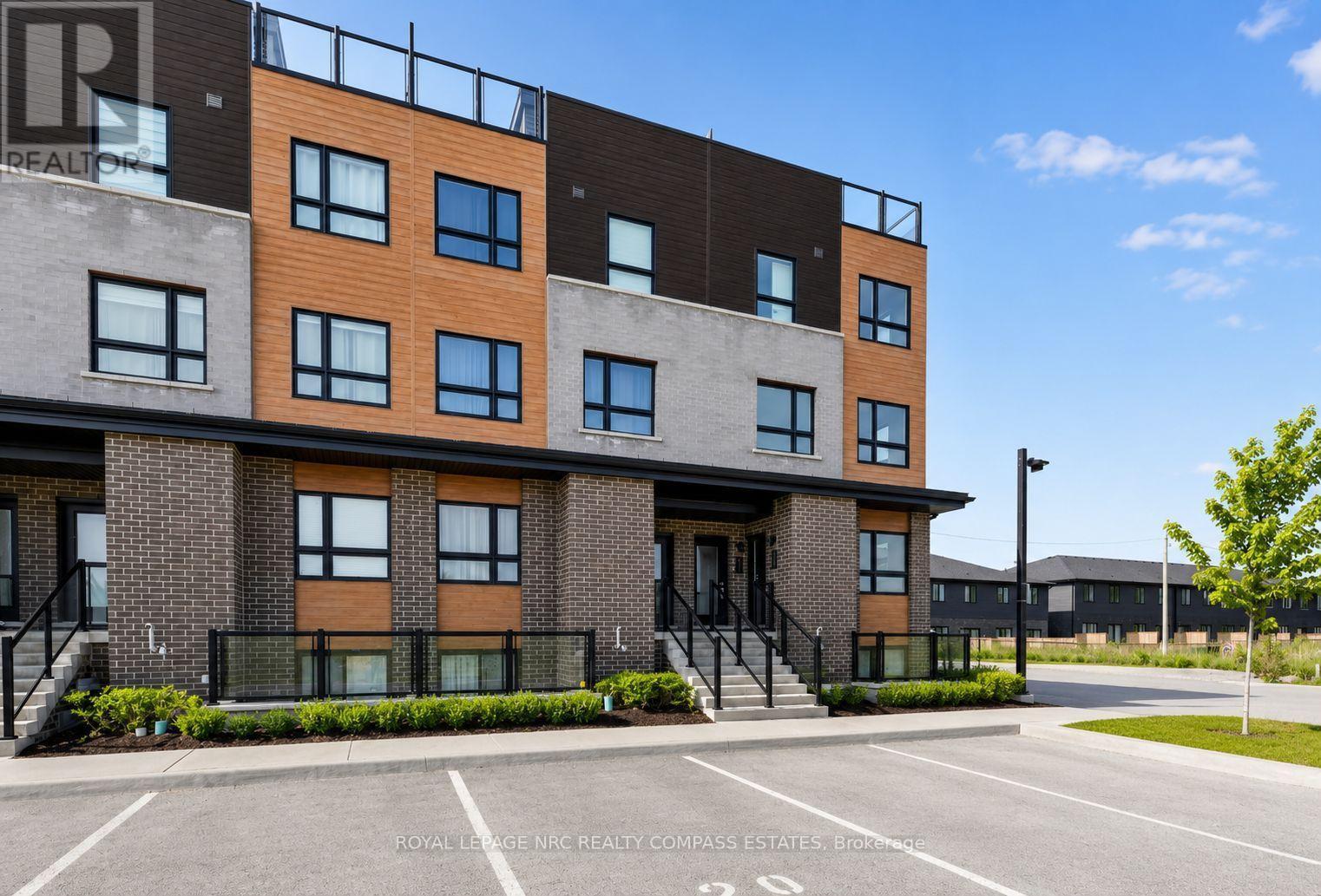 119 - 6705 Cropp Street, Niagara Falls (Morrison), ON - Outdoor With Facade