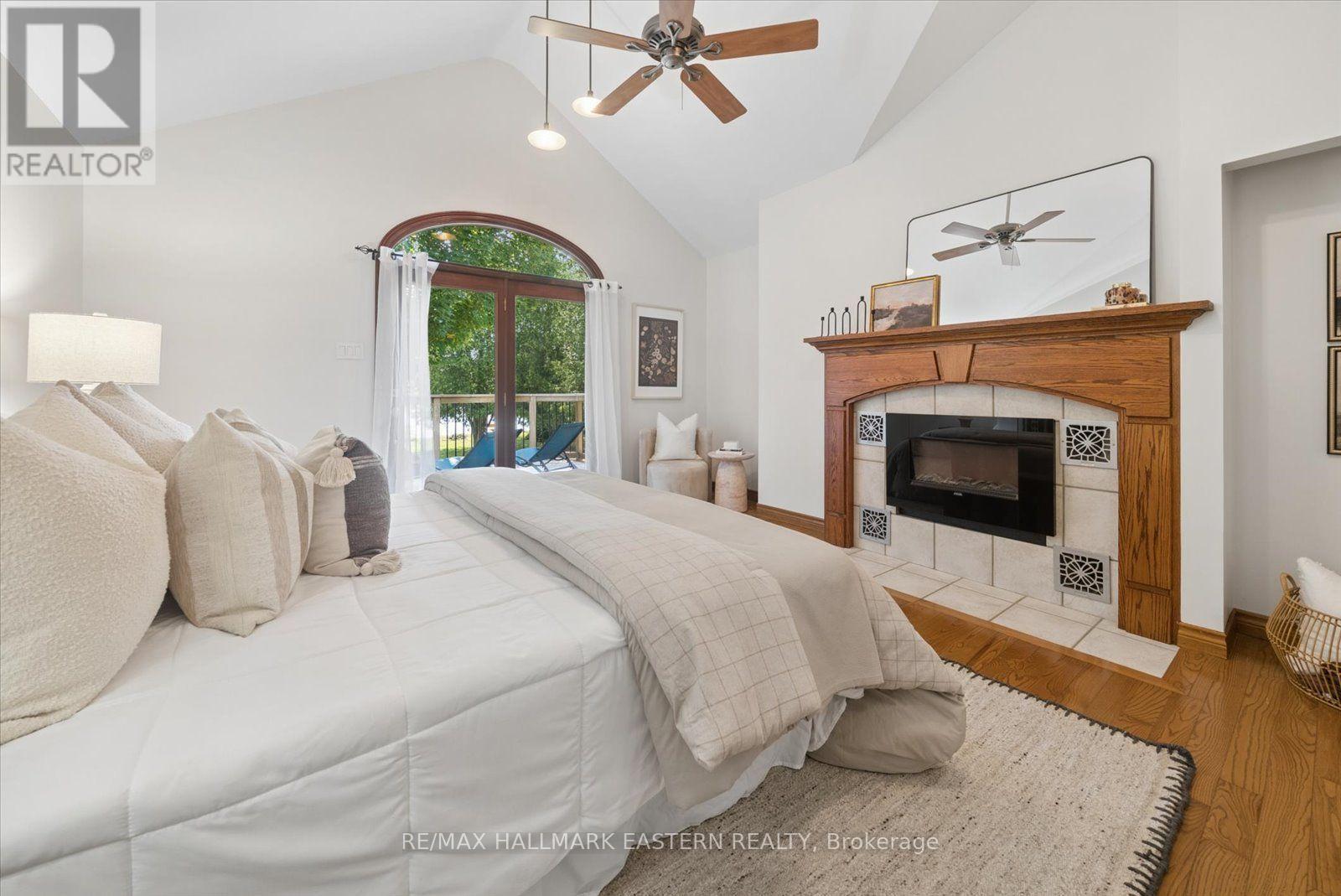 1041 Primrose Lane, Selwyn, ON - Indoor Photo Showing Bedroom With Fireplace