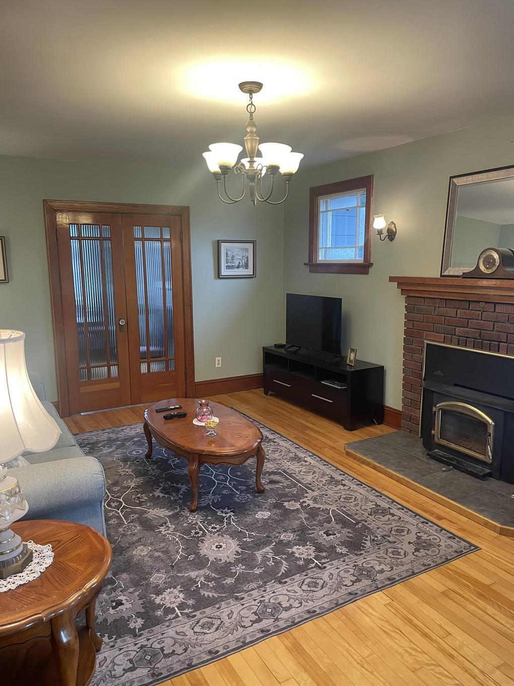 11 Belle Avenue, Souris, PE - Indoor Photo Showing Living Room With Fireplace