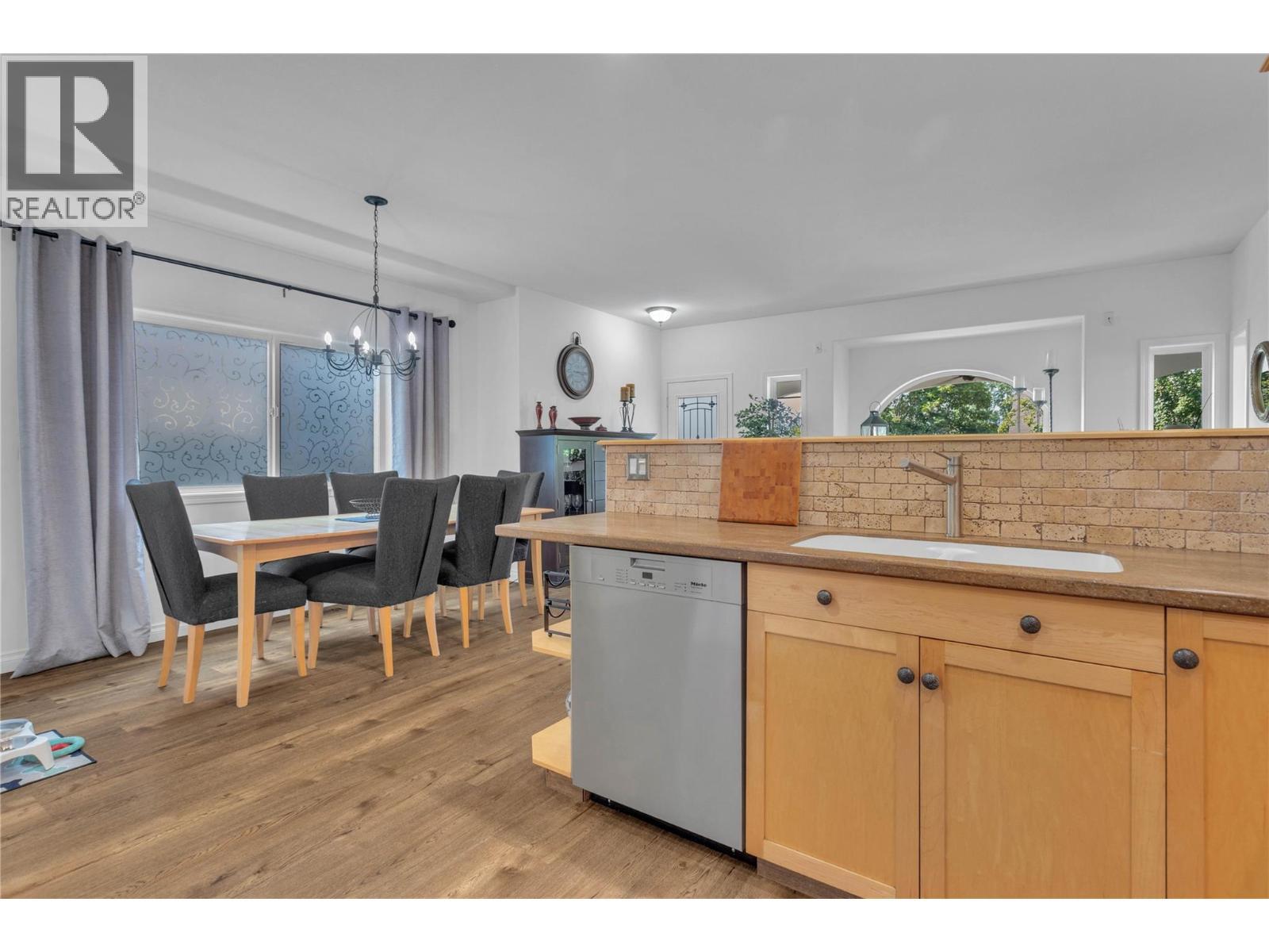 Dining room viewed from the kitchen. - 430 Mccarren Avenue, Kelowna, BC - Indoor