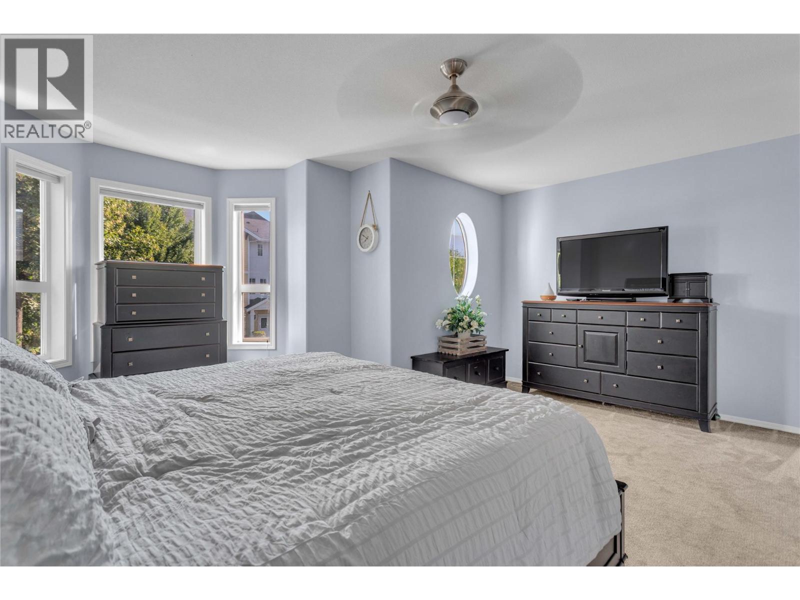 Primary suite on the upper floor. - 430 Mccarren Avenue, Kelowna, BC - Indoor Photo Showing Bedroom