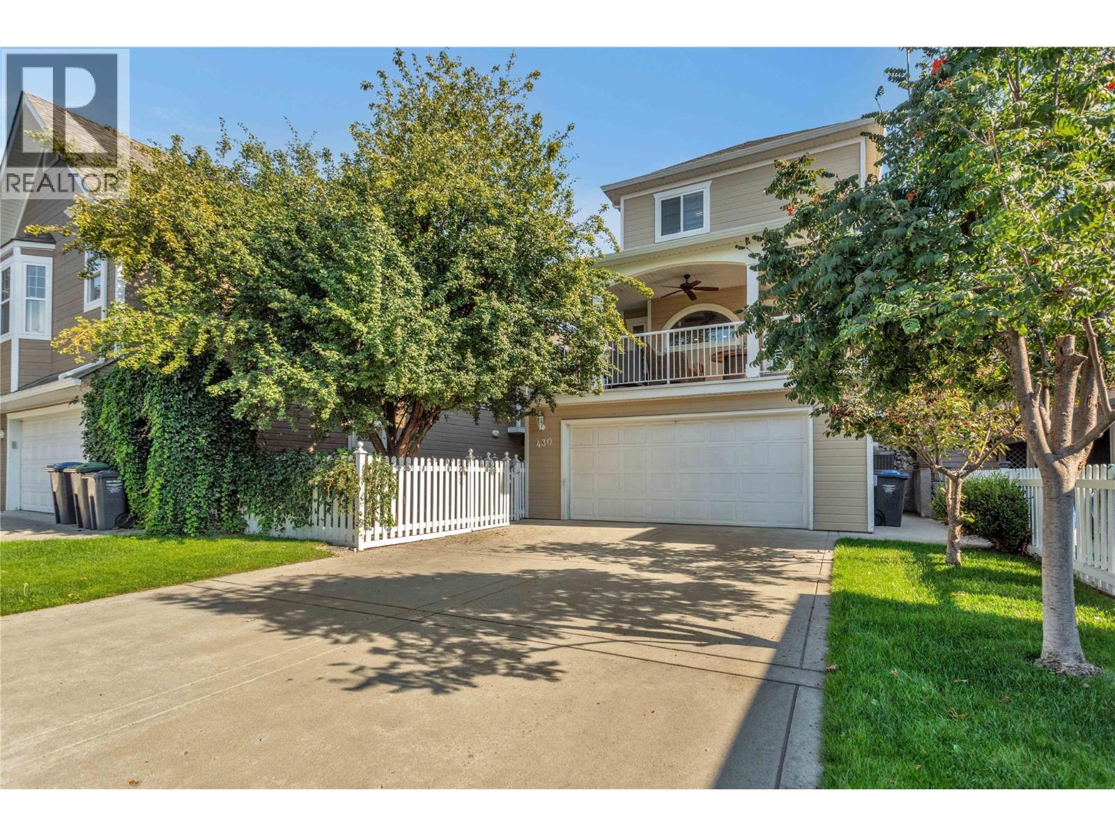 Garage and driveway viewed from the back entrance. - 430 Mccarren Avenue, Kelowna, BC - Outdoor