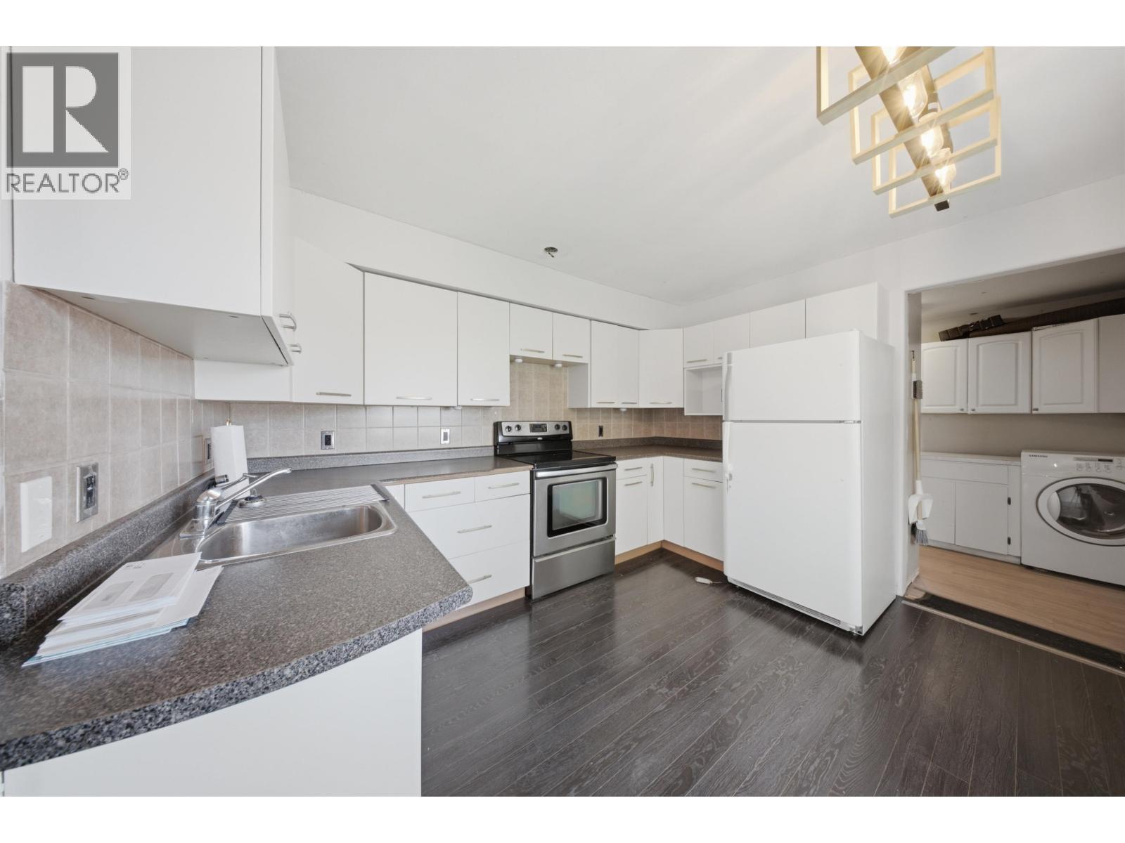 9311 103 Avenue, Fort St. John, BC - Indoor Photo Showing Kitchen With Double Sink