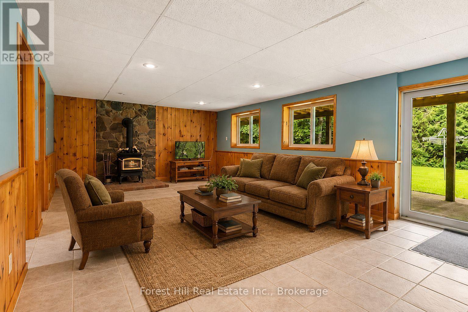 Virtually staged Family Room - 344511 North Line, West Grey, ON - Indoor Photo Showing Living Room With Fireplace