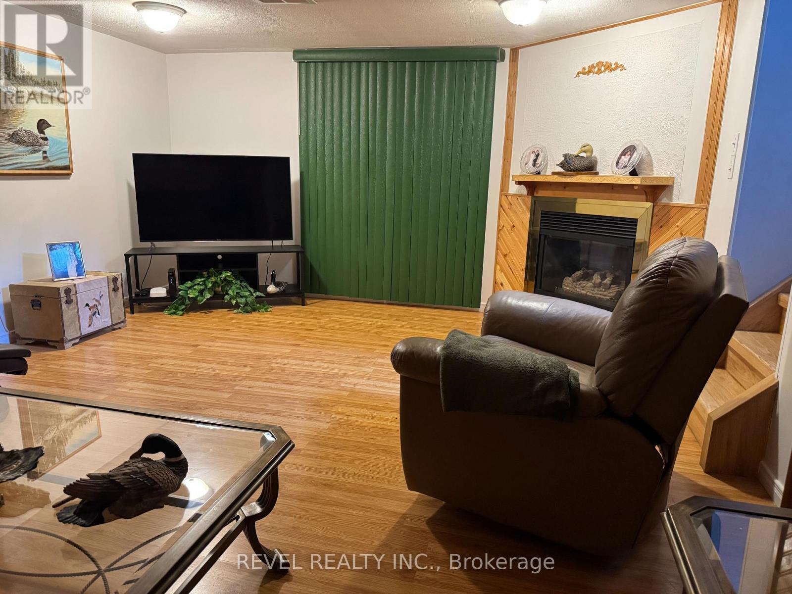 214 Birch Street S, Timmins (Ts - Se), ON - Indoor Photo Showing Living Room With Fireplace