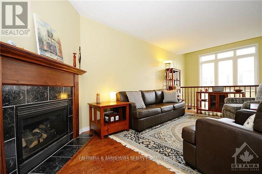 220 Freedom Private, Ottawa, ON - Indoor Photo Showing Living Room With Fireplace