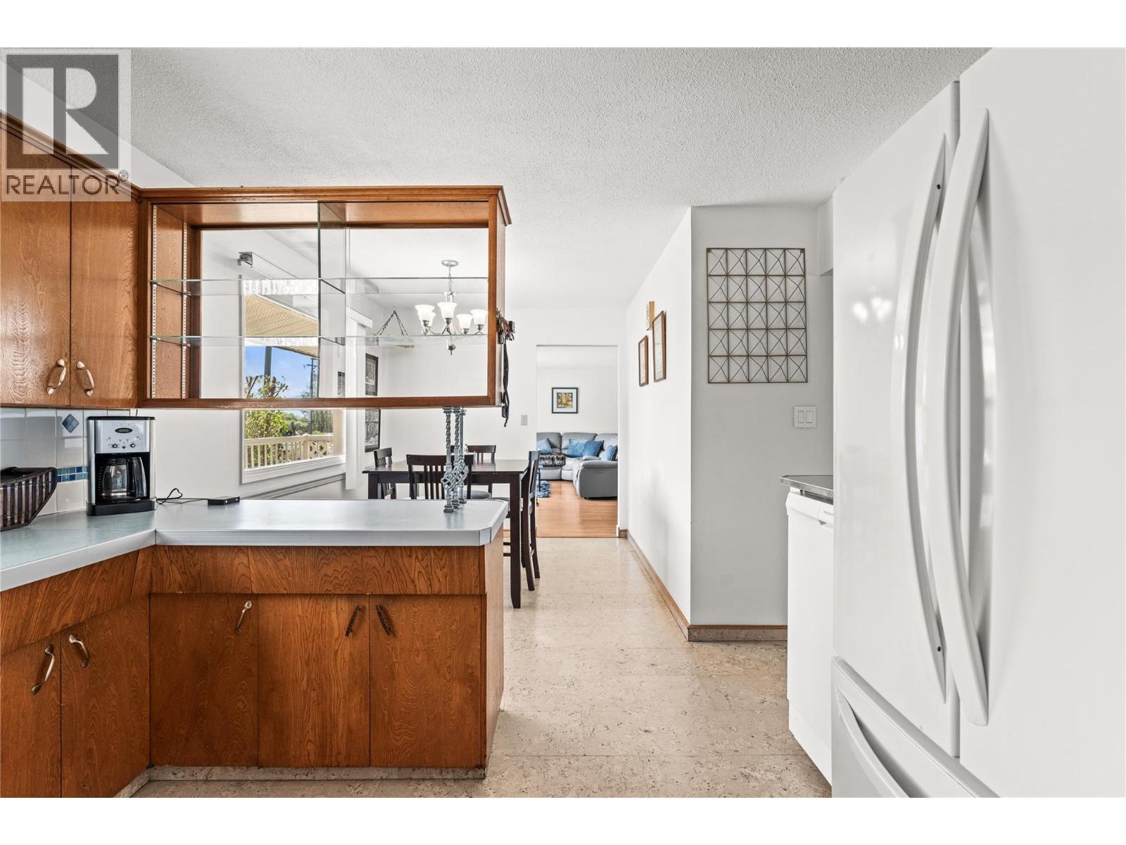 Main Level Laundry - 1603 43Rd Avenue, Vernon, BC - Indoor Photo Showing Kitchen