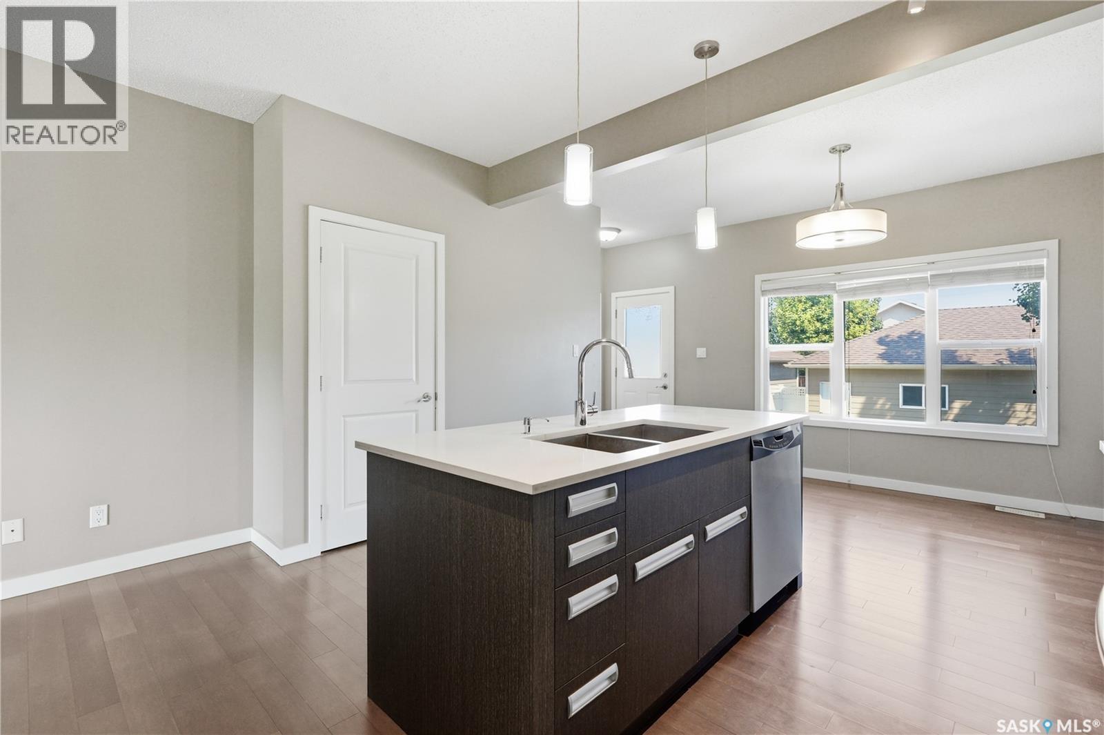 924 Stonebridge Common, Saskatoon, SK - Indoor Photo Showing Kitchen With Double Sink