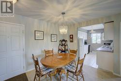 Dining room by entrance and open to kitchen window -
