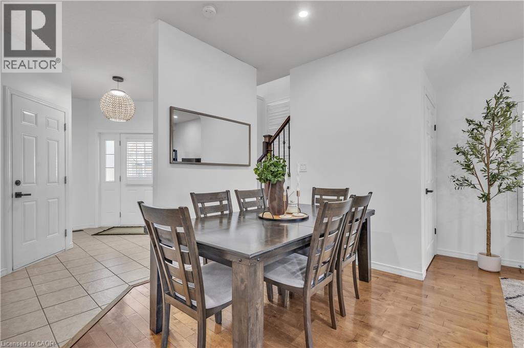 Dining area with wood-finish flooring, recessed lighting, and a neutral color palette - 73 Fitzgerald Drive, Cambridge, ON - Indoor Photo Showing Dining Room