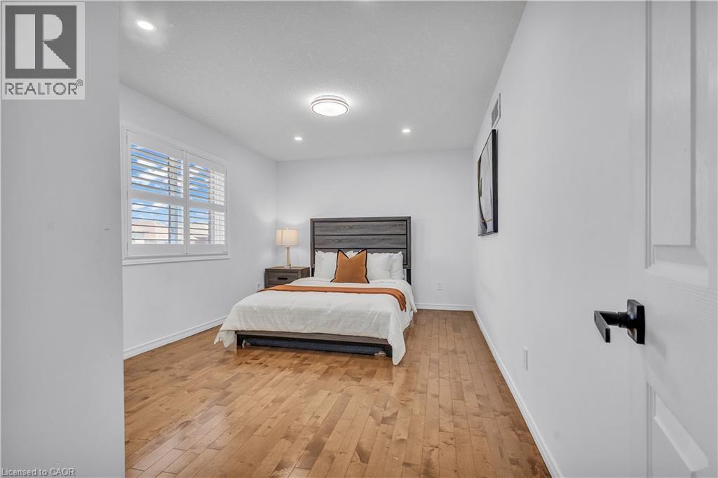 Wood-finish flooring throughout - 73 Fitzgerald Drive, Cambridge, ON - Indoor Photo Showing Bedroom