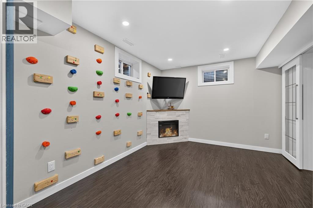 104 Udell Way, Grimsby, ON - Indoor Photo Showing Other Room With Fireplace