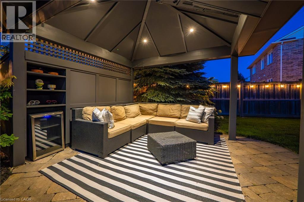 Covered patio featuring recessed lighting, built-in shelving, and a beverage cooler - 1533 Morse Place, Milton, ON - Photo Showing Other Room