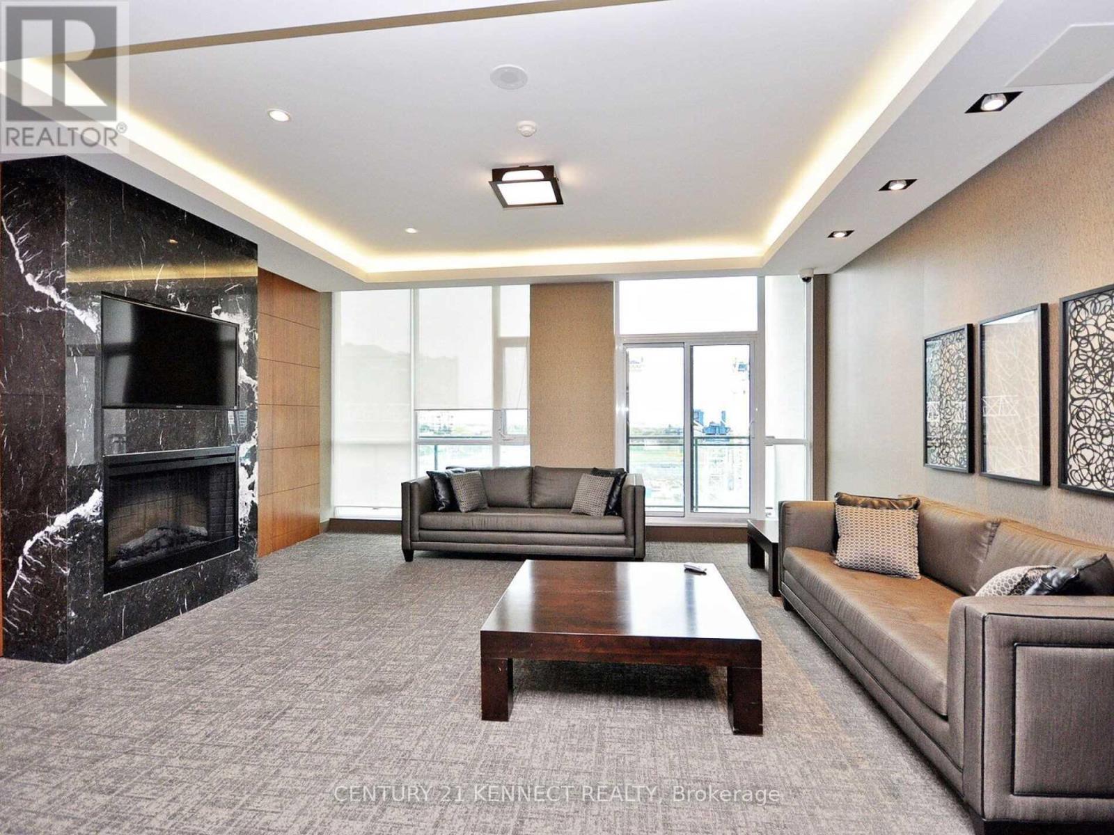 3910 - 4070 Confederation Parkway, Mississauga, ON - Indoor Photo Showing Living Room With Fireplace