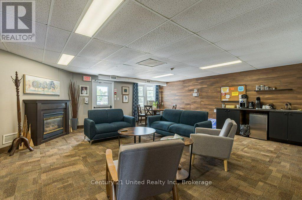 11 Algonquin Trail, Clarington (Bowmanville), ON - Indoor Photo Showing Living Room With Fireplace