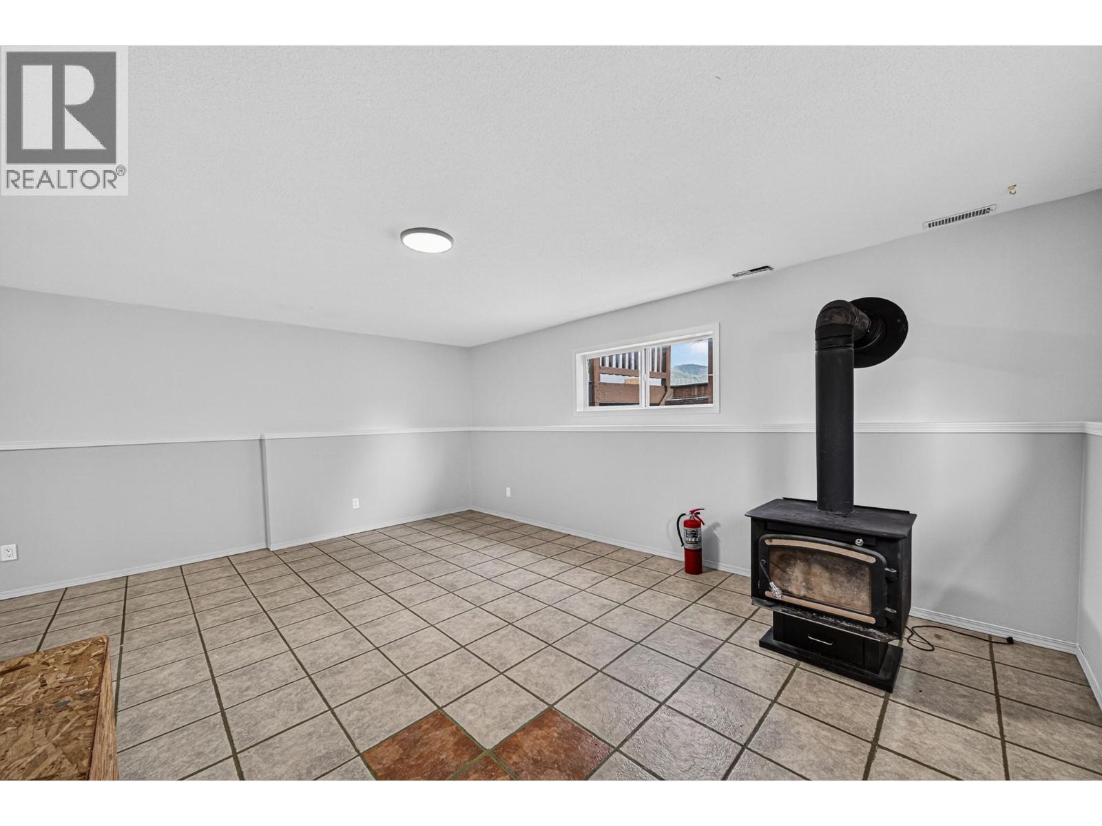 1255 Valley View Drive, Sparwood, BC - Indoor Photo Showing Other Room With Fireplace