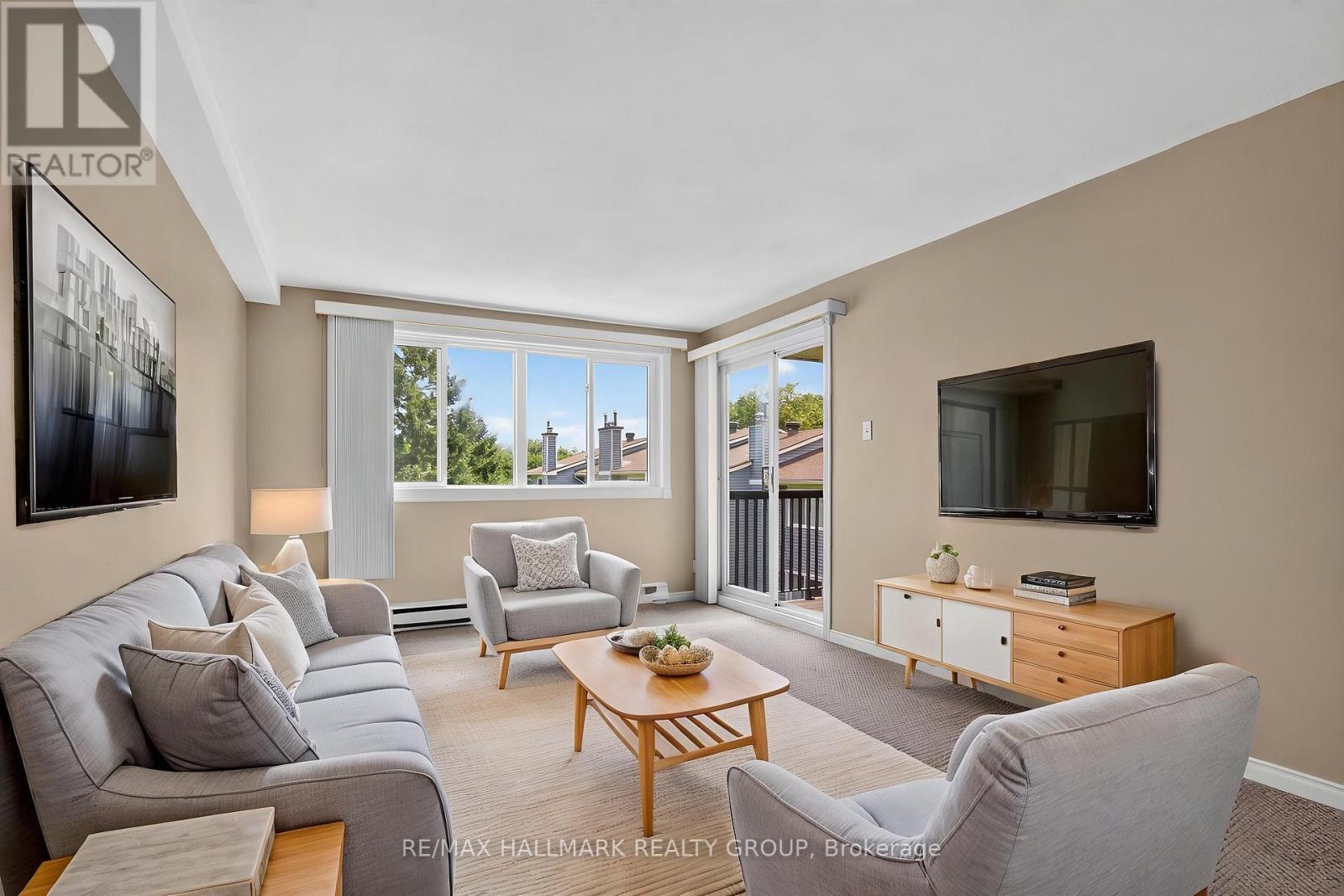 Living Room - virtually staged - 306 - 6470 Bilberry Drive, Ottawa, ON - Indoor Photo Showing Living Room