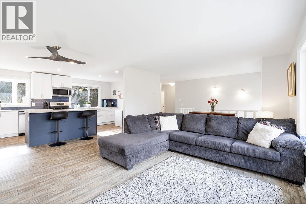 Main floor open to the living room and kitchen. Ideal for entertaining. - 2527 Islandview Road, Blind Bay, BC - Indoor Photo Showing Living Room