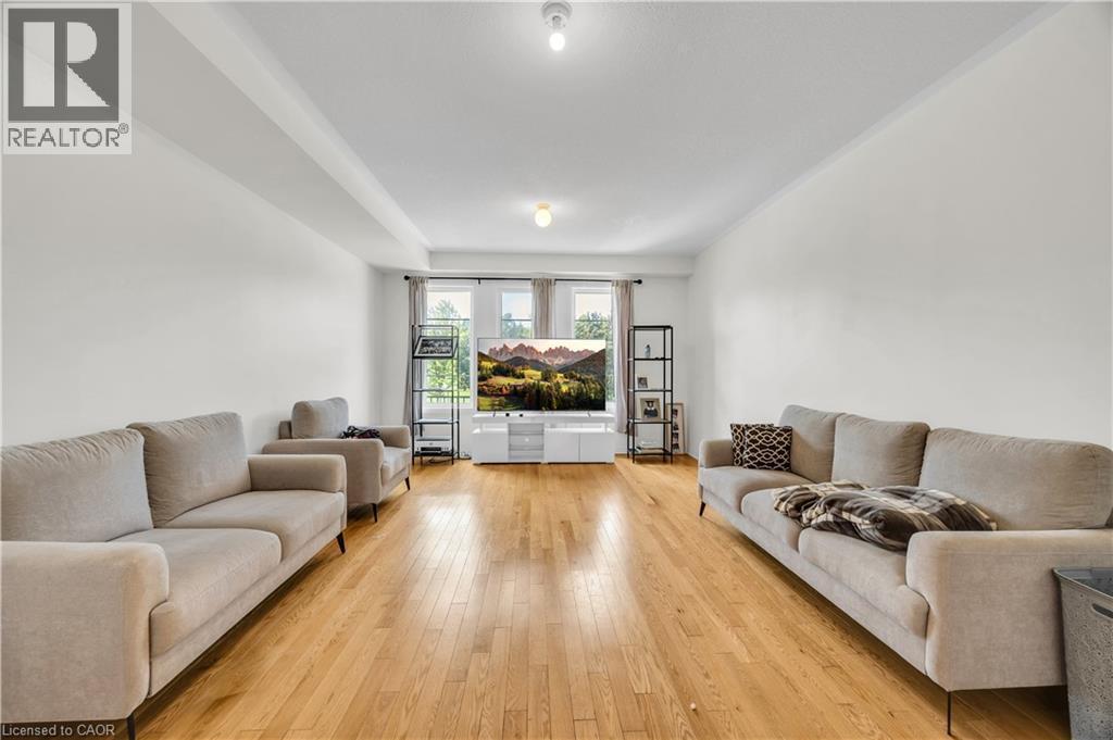 Spacious living area featuring light wood-finish flooring - 1451 Green Road, Bowmanville, ON - Indoor Photo Showing Living Room