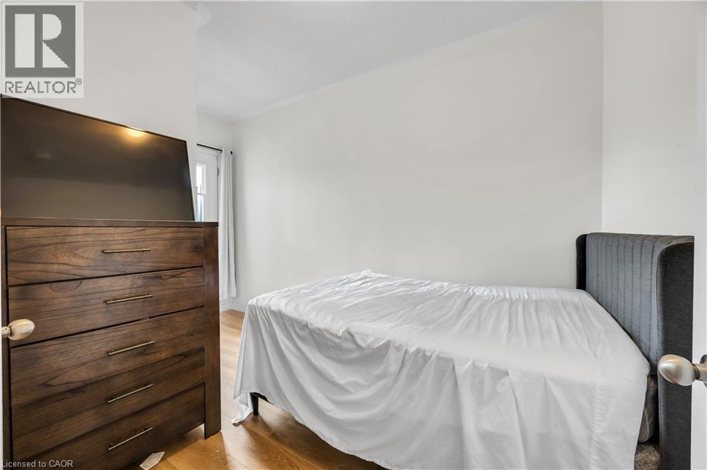Hardwood-style flooring throughout - 1451 Green Road, Bowmanville, ON - Indoor Photo Showing Bedroom