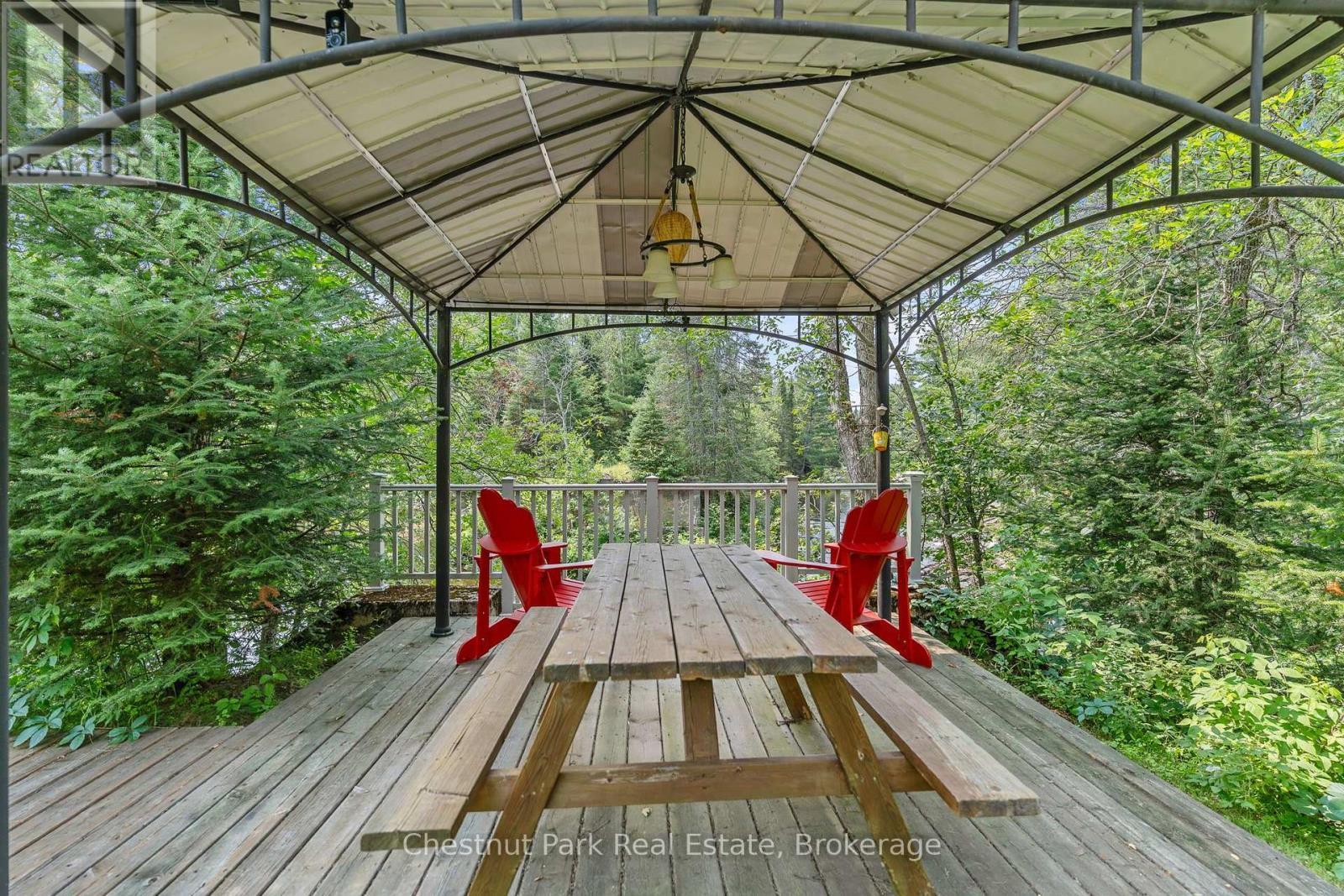 Covered Deck Overlooking Rapids - 8488 County Road 503 Road, Highlands East (Glamorgan), ON - Outdoor With Deck Patio Veranda