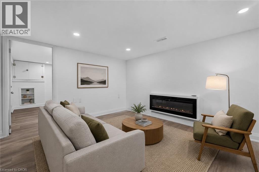 Virtually Staged - 36 Mahony Avenue, Hamilton, ON - Indoor Photo Showing Living Room With Fireplace